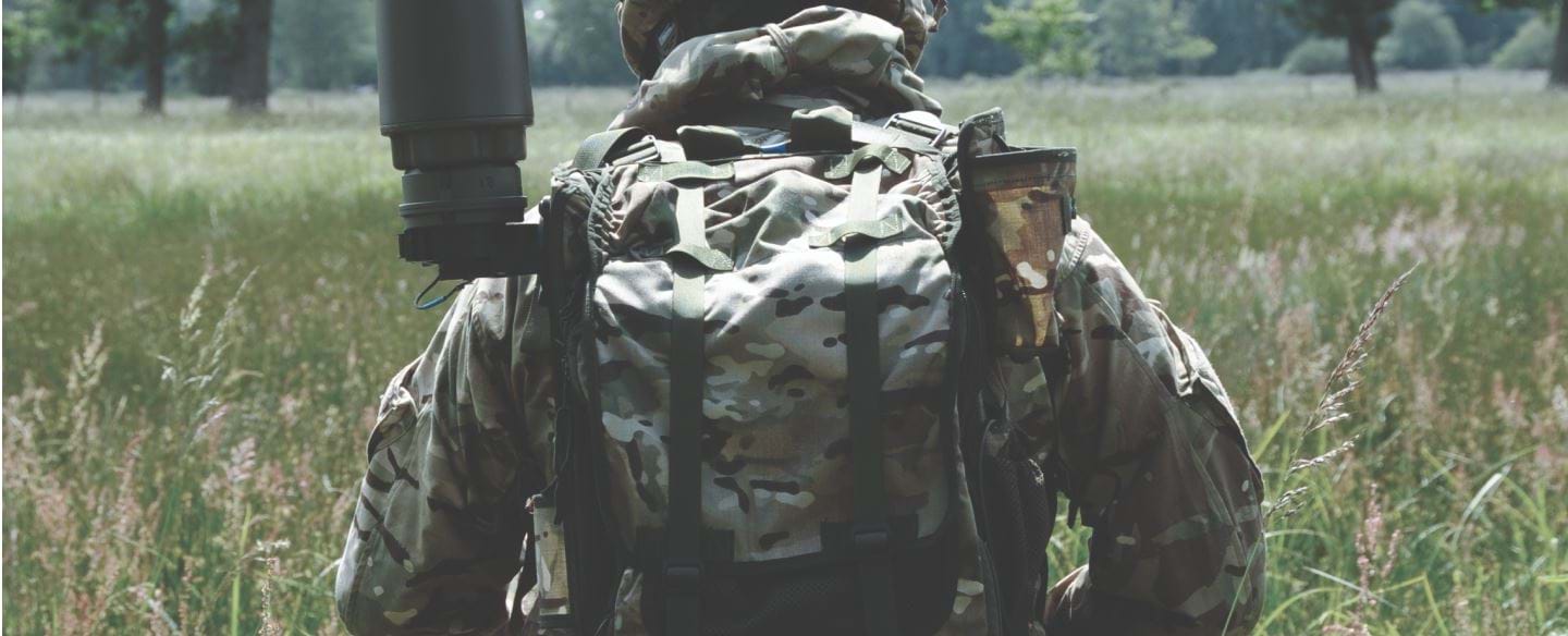 A soldier wearing a RESOLVE from the back