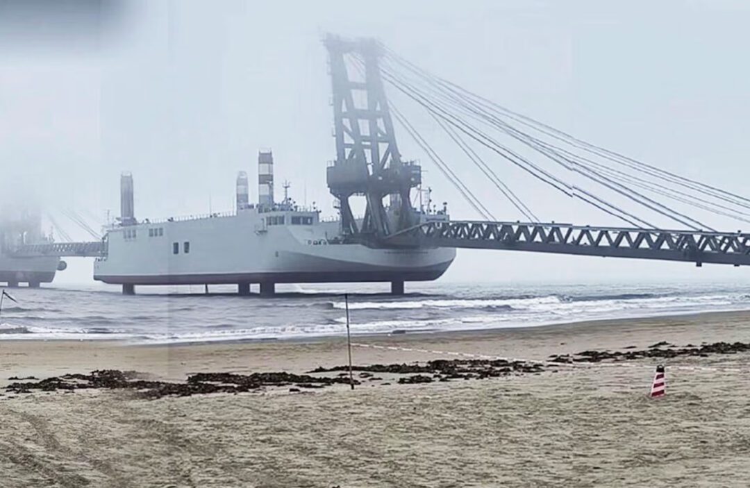 A screenshot from Chinese social media displaying one of the military barges with its ‘jack up’ pillars down, connected to another barge to make a pier. Source: The Guardian