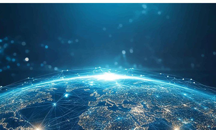 A digitally created image of the world with a graphic of a network overlaid.